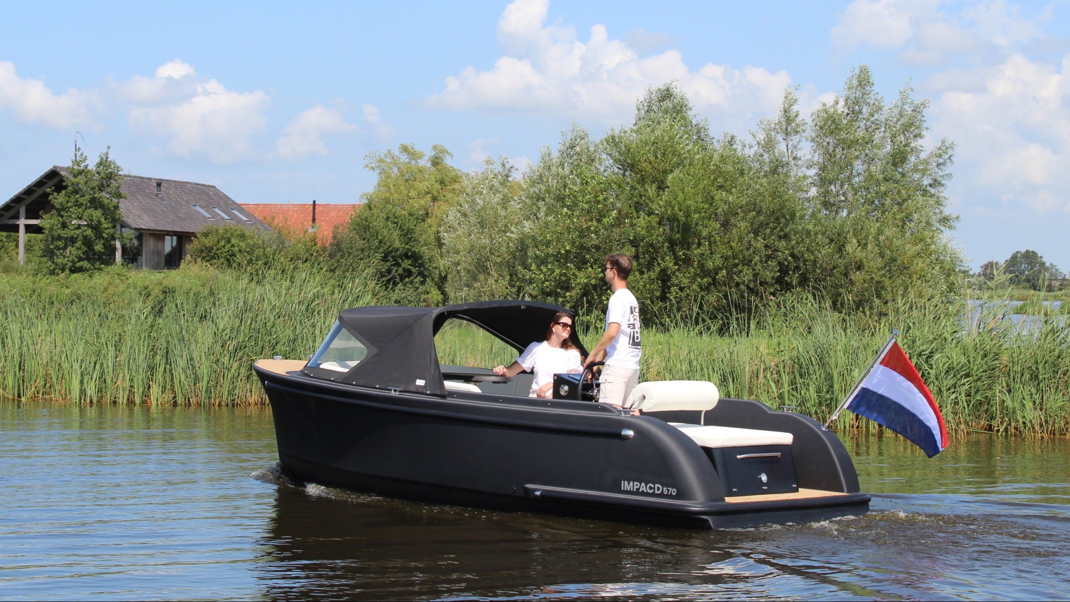 IMPACD 570 3D printed electric sloop cruising the water, side view